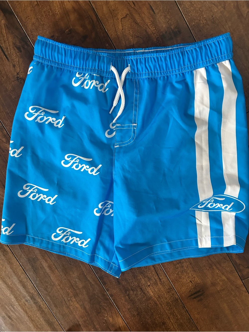 NEW. Tags are removed. Ford Blue Kids Swim Trunks with White Logo Stripes.